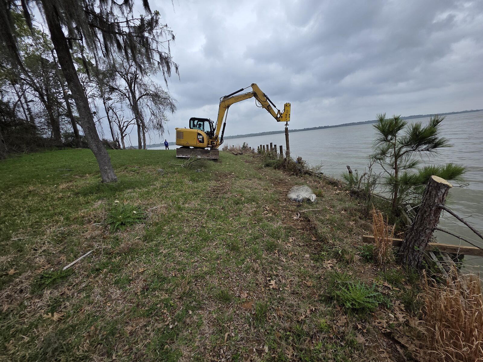 Private waterfront lawn and pier on a Texas lake — the residential setting for a Shore Tech entertainment boathouse